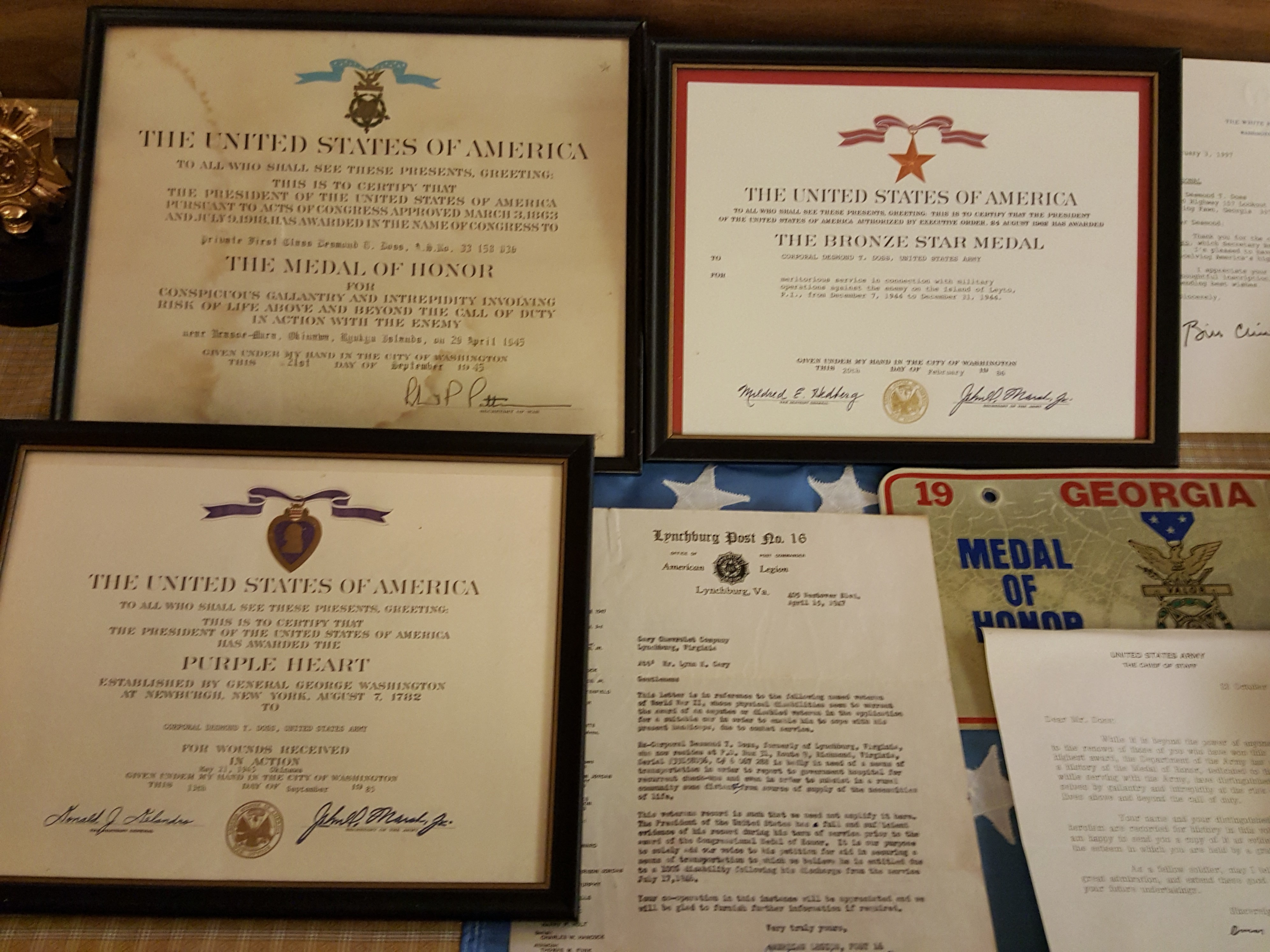 Various certificates for Doss's heroic efforts.