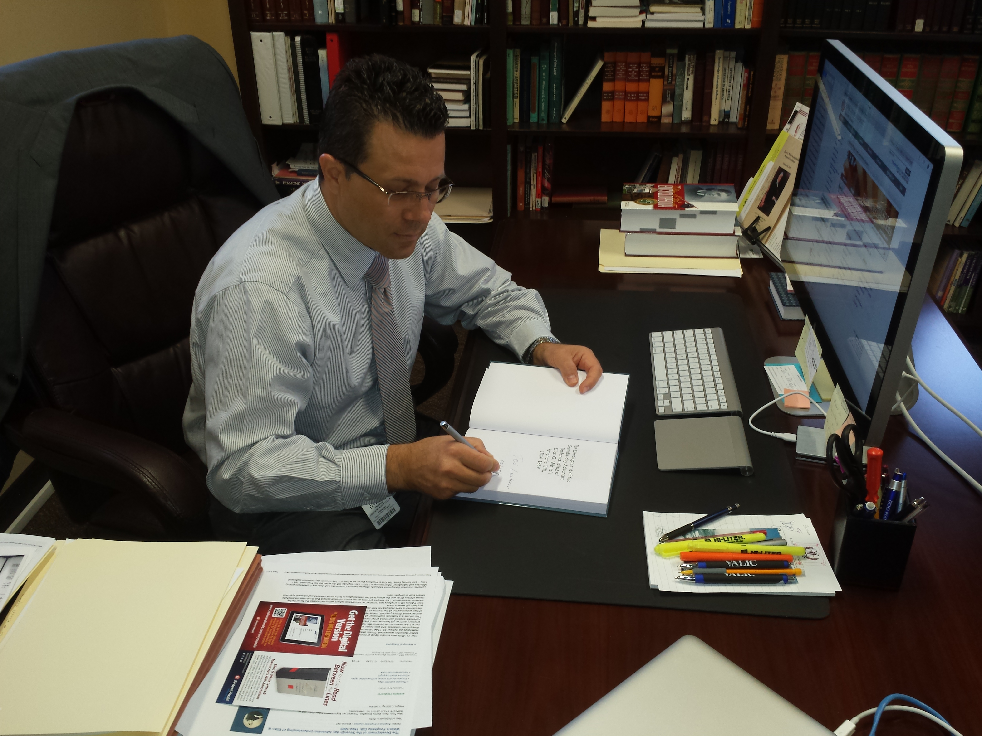 Dr. Levterov signing his newly published book.
