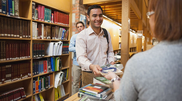 librarian checking out a book 