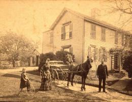 old image of horse people and house