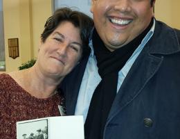 University Archivist and Chair of the Department of Archives and Special Collections, Lori N. Curtis, and her Assistant, Michael Olivarez holding the newly discover photograph